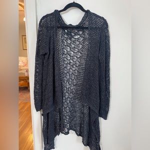 Black crocheted sweater. Short front and lower back.